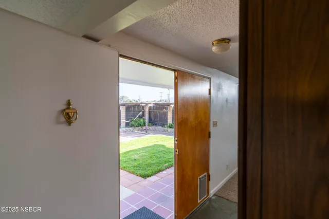 a view of livingroom with furniture and floor to ceiling window