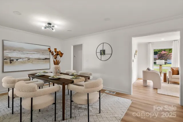 a view of a livingroom with furniture and a table