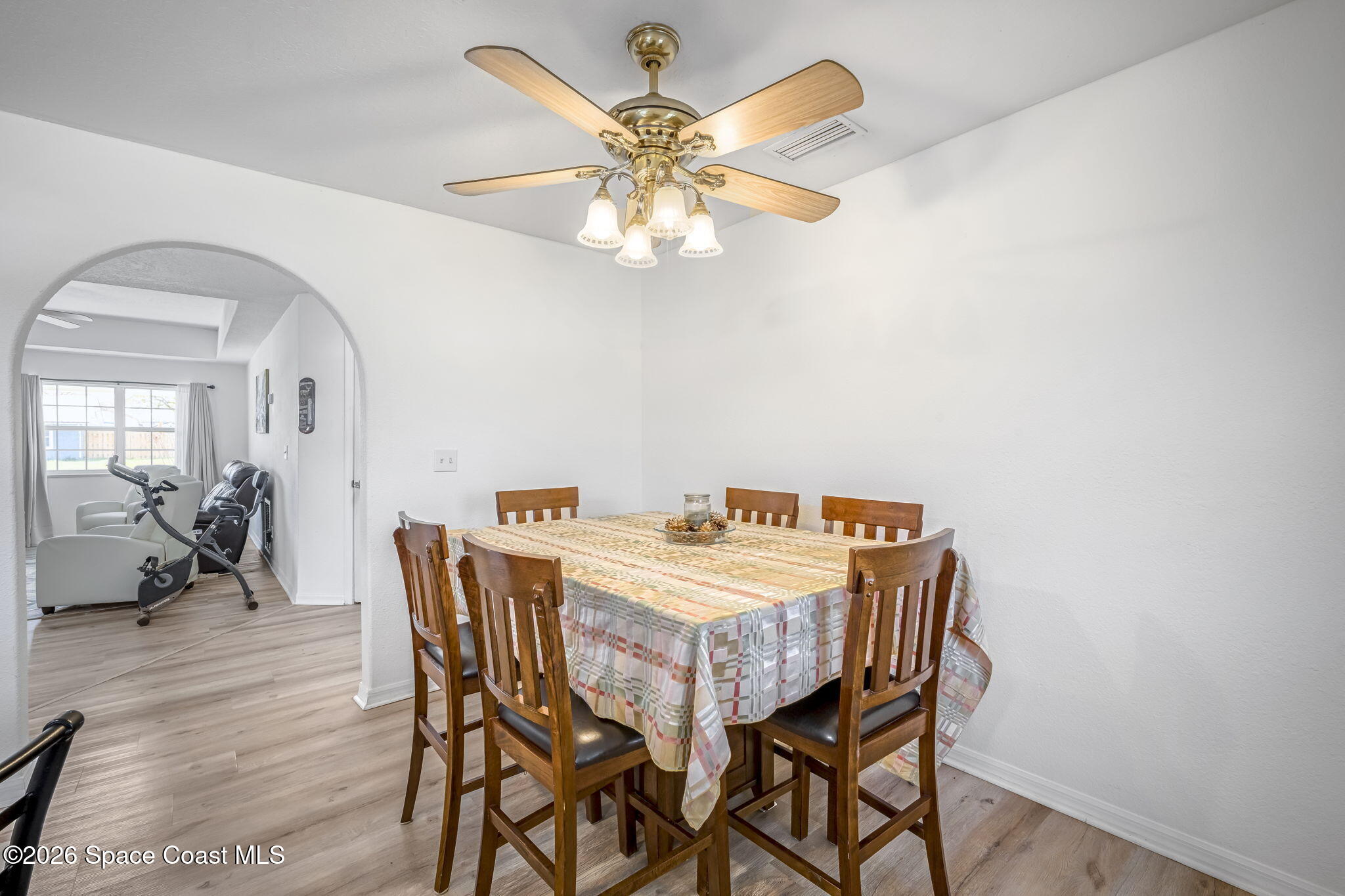 3404 Kilbee Street Mims, FL 32754 - Photo 14 of 30 a view of a dining room with furniture and wooden floor