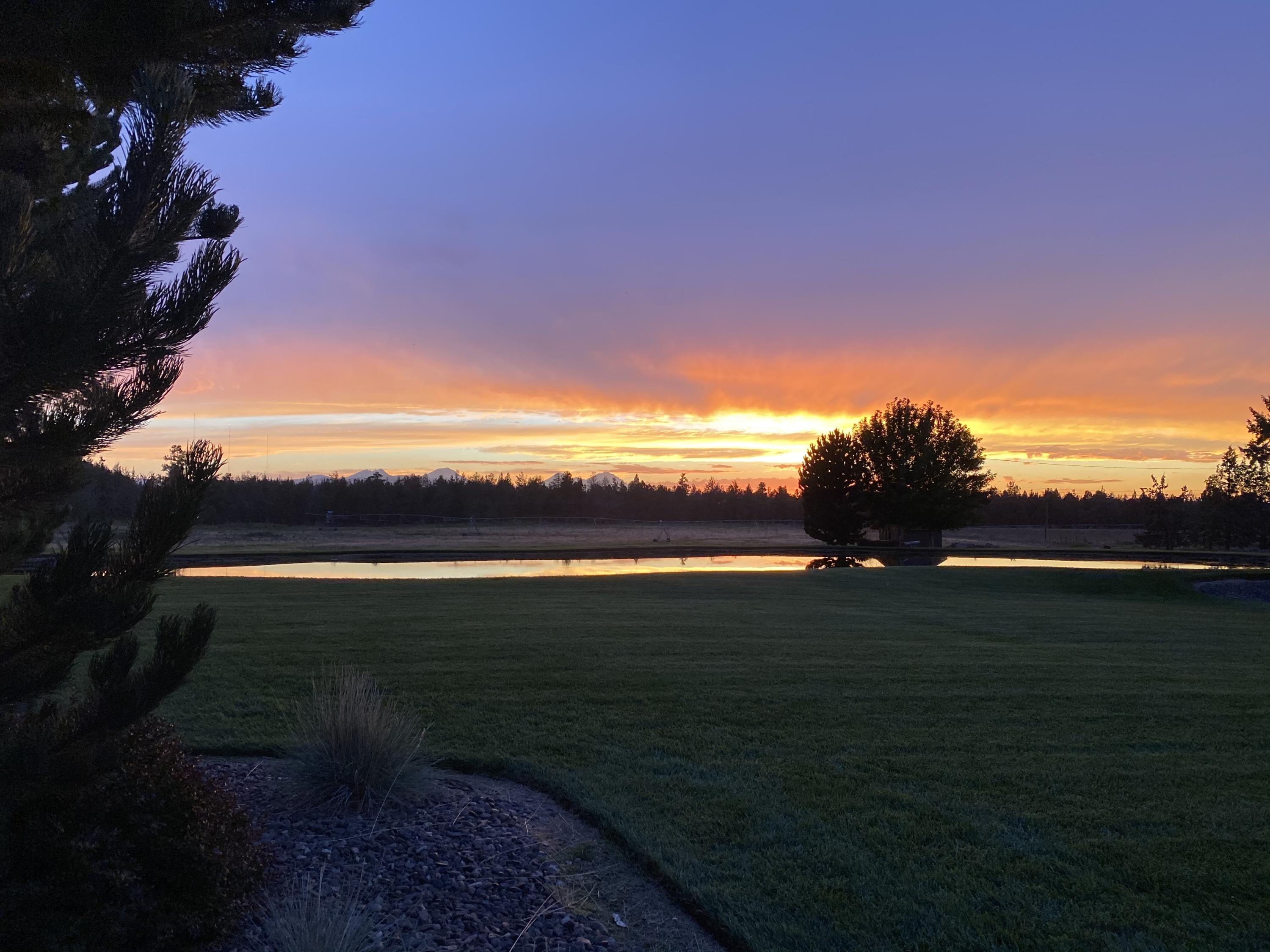 63575 Cricketwood Road Bend, OR 97701 - Photo 5 of 53 a view of an ocean and a yard