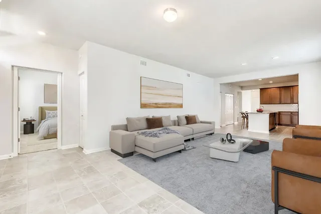 a living room with furniture and a large window