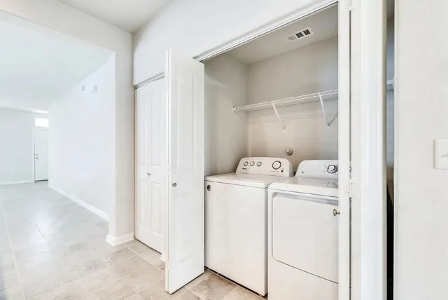 a utility room with dryer and washer