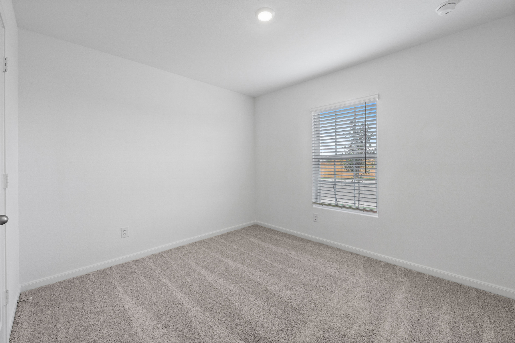 401 Silent Meadow Run Maxwell, TX 78656 - Photo 10 of 11 Unfurnished room featuring light carpet and baseboards