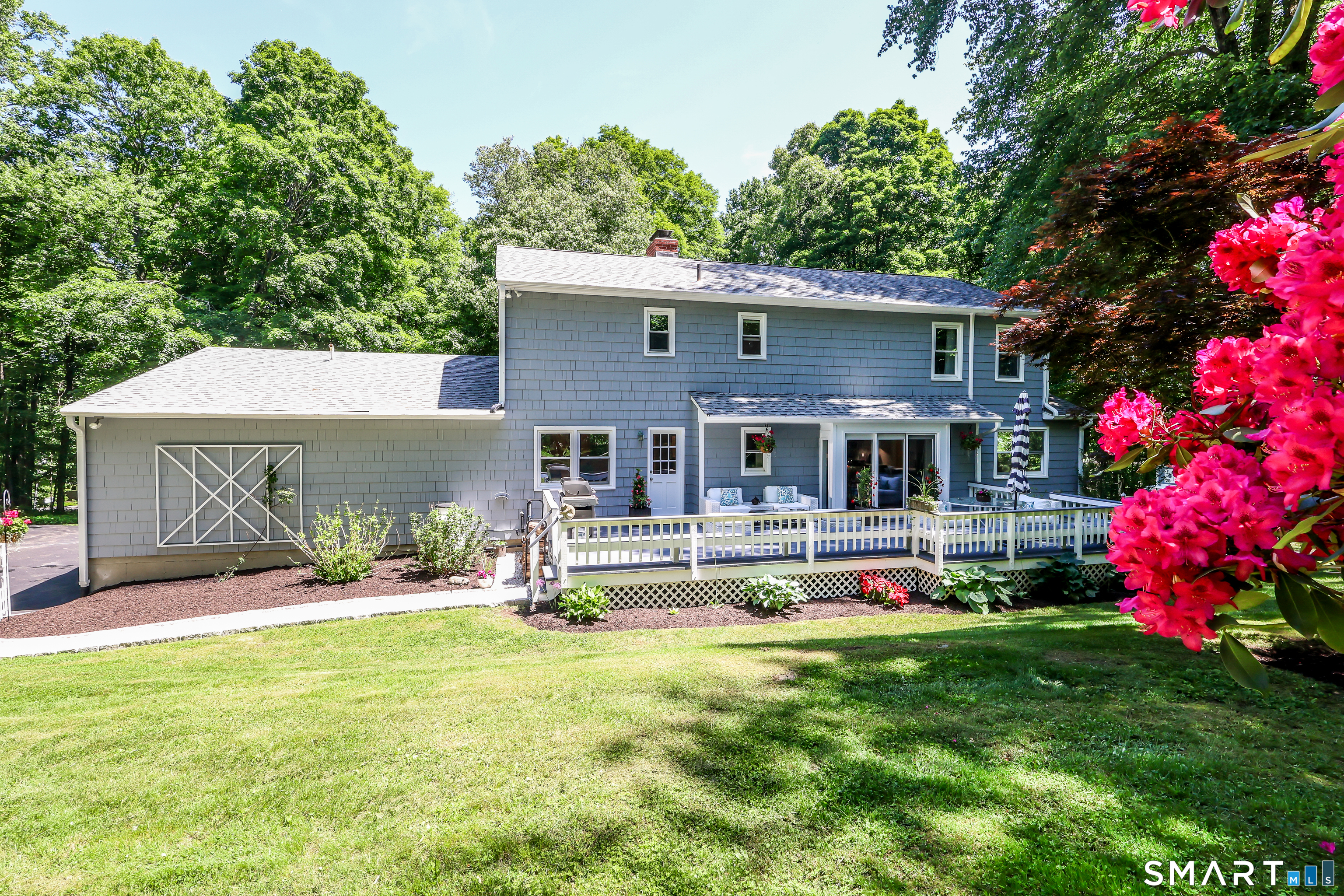 23 Old Green Road Newtown, CT 06482 - Photo 28 of 36 a view of house with outdoor seating and yard