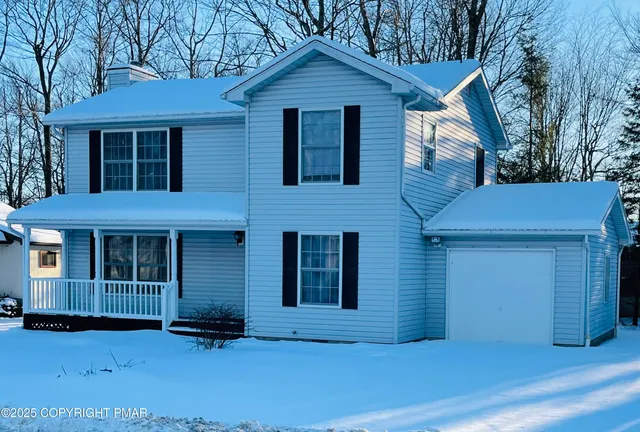 a view of brick house with large windows