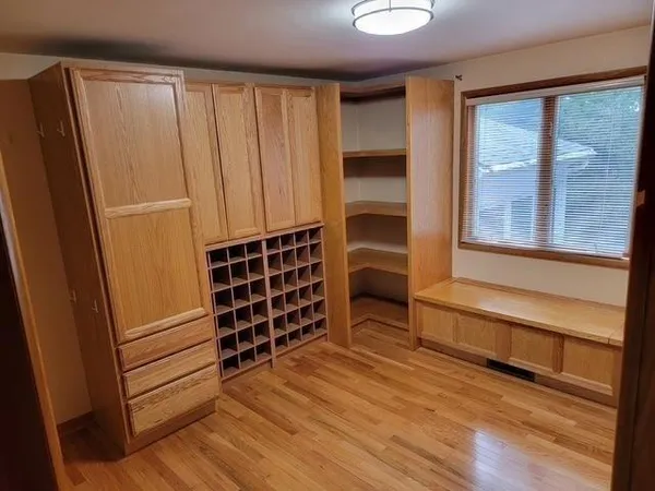 a view of wooden floor and windows in a room