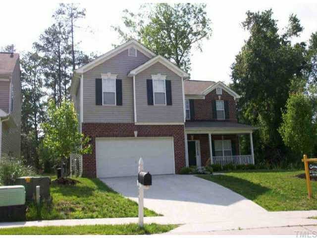 4824 Heatherfield Way Raleigh, NC 27604 - Photo 1 of 1 a front view of a house with a yard and garage