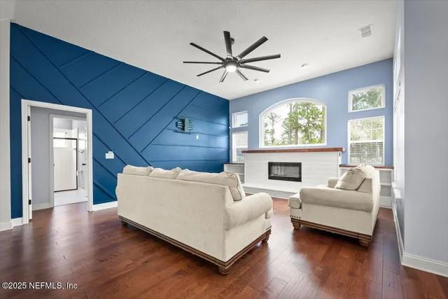 a living room with furniture and a fireplace