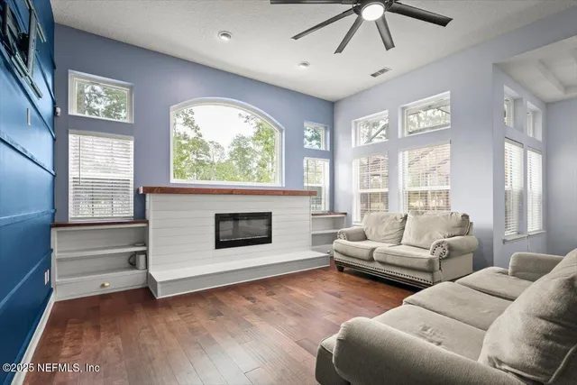 a living room with furniture and a fireplace