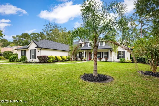 a front view of house with yard and green space