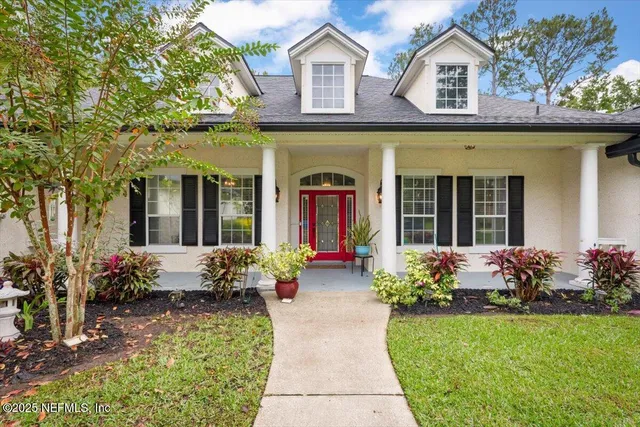 a front view of a house with an outdoor seating