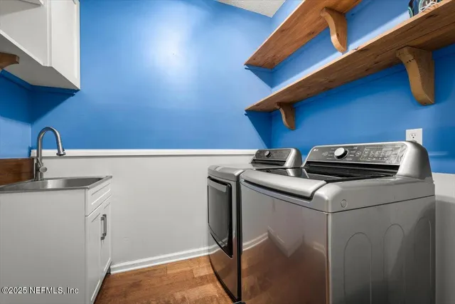 a utility room with dryer and washer
