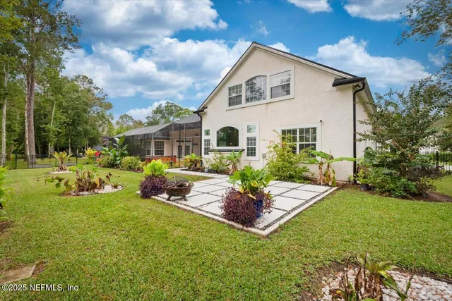 a front view of house with garden and patio