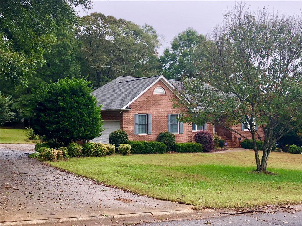 130 Holly Ridge Drive Anderson, SC 29621 - Photo 2 of 33 Wide concrete drive leads to the 2 car garage.