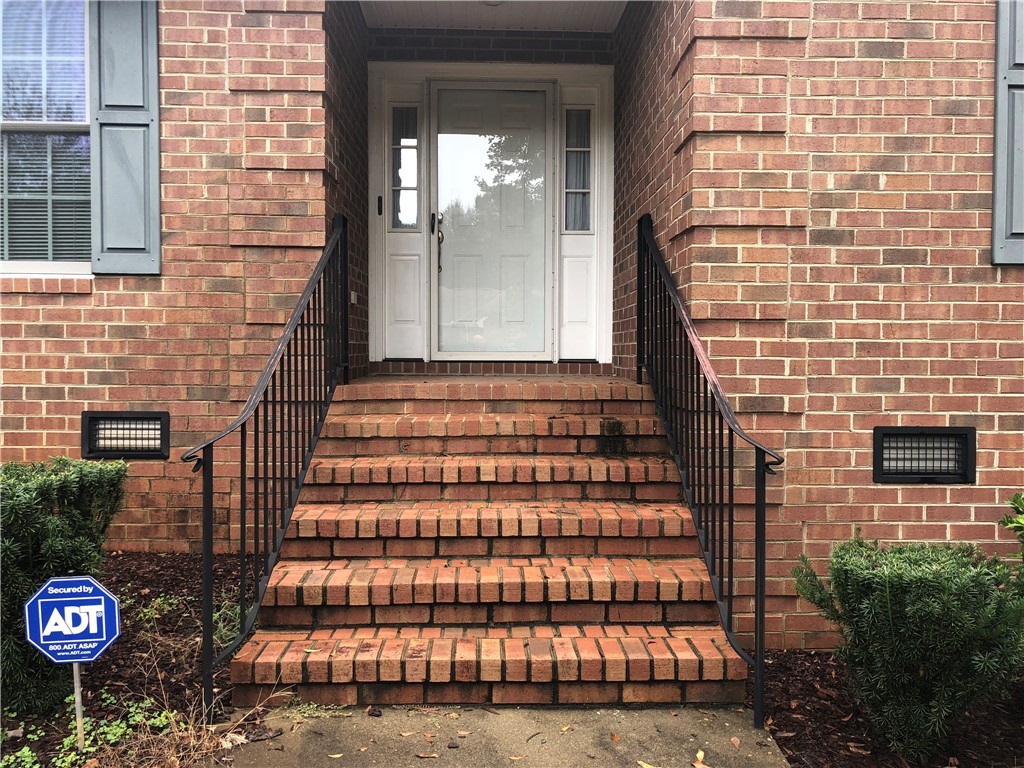 130 Holly Ridge Drive Anderson, SC 29621 - Photo 4 of 33 Iron railing leads to the front porch. The porch f