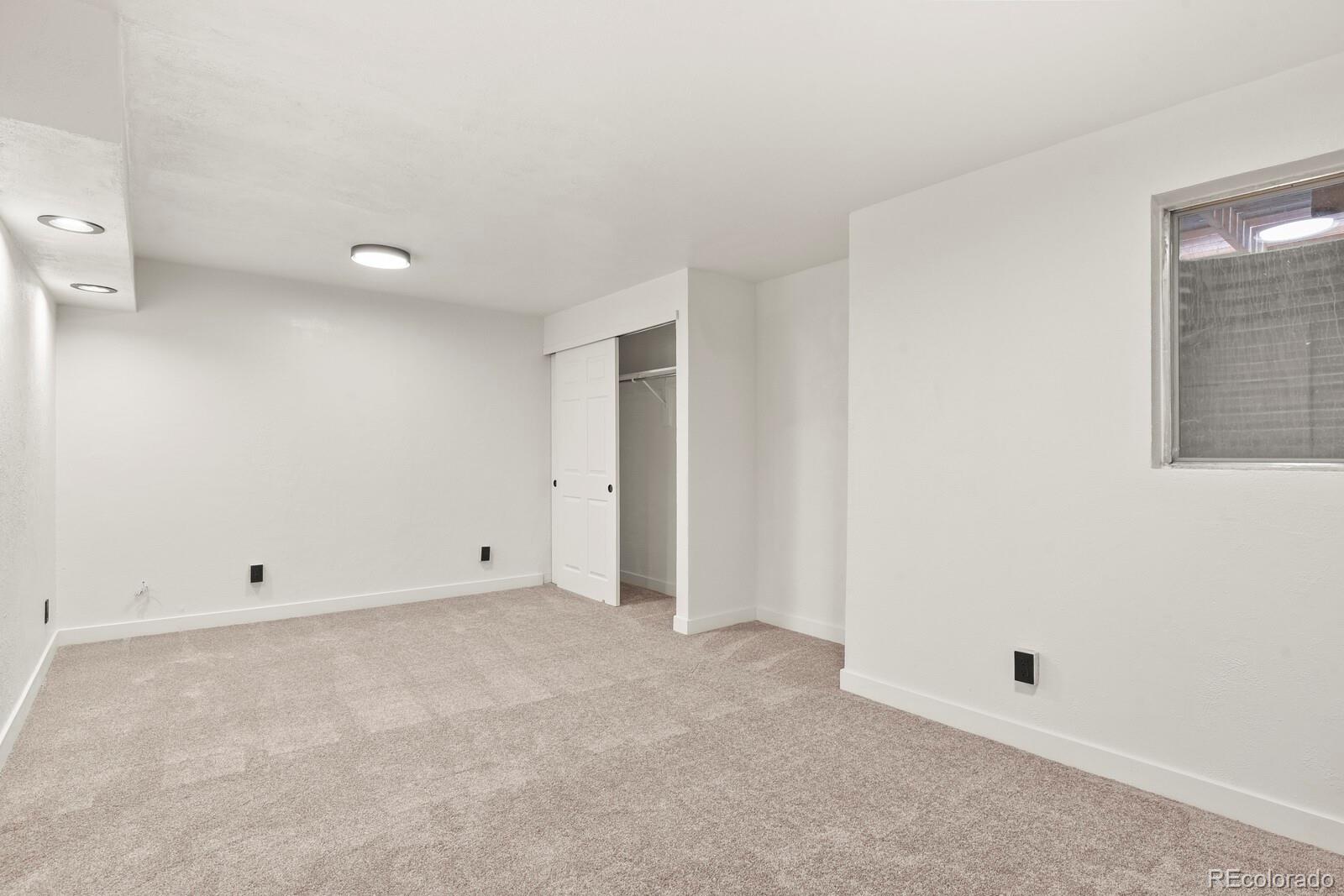8771 Carr Loop Arvada, CO 80005 - Photo 11 of 16 an empty room with a natural light