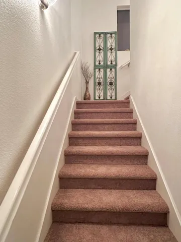 an empty room with wooden floor and closet
