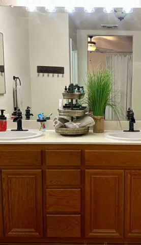 a bedroom with bed and a chandelier