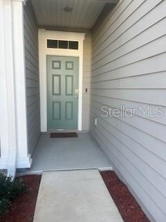 64 Redbud Road Palm Coast, FL 32137 - Photo 3 of 14 a view of front door of house