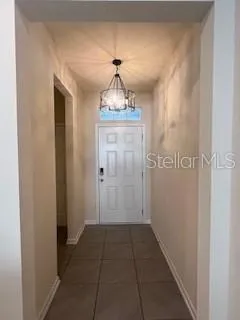 a view of a hallway to a bedroom