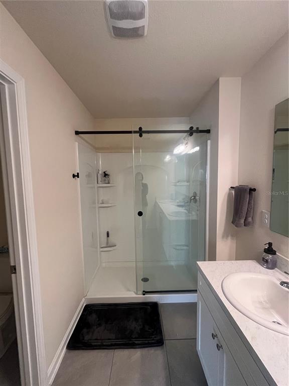 64 Redbud Road Palm Coast, FL 32137 - Photo 9 of 14 a bathroom with a sink toilet and shower