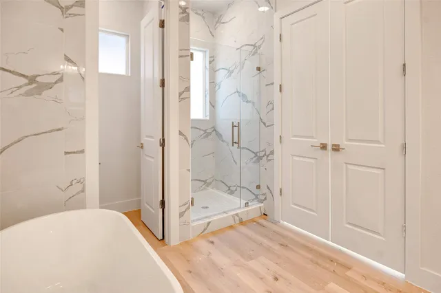 a bathroom with a bathtub and shower