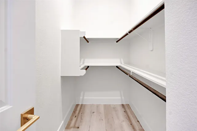 a view of an empty walk in closet