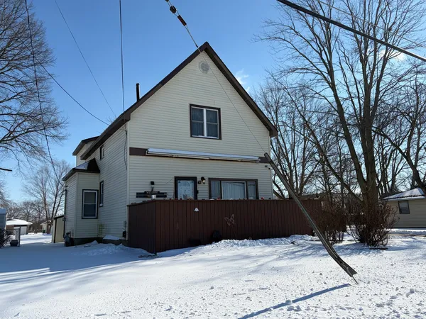 a view of house with yard