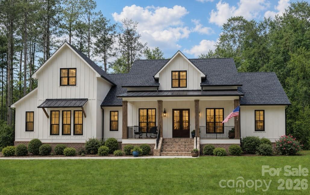 9745 Flowes Store Road Midland, NC 28107 - Photo 1 of 20 a front view of a house with a yard