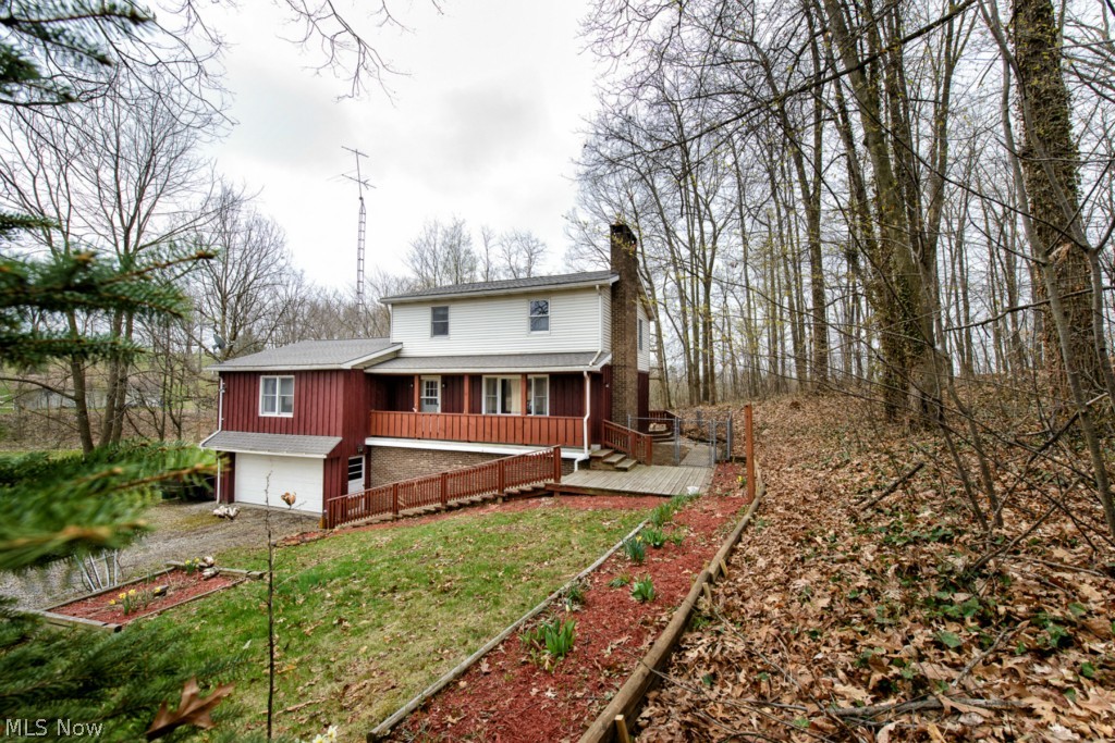 24797 Ridge Road East Rochester, OH 44625 - Photo 2 of 20 Front with view of side yard