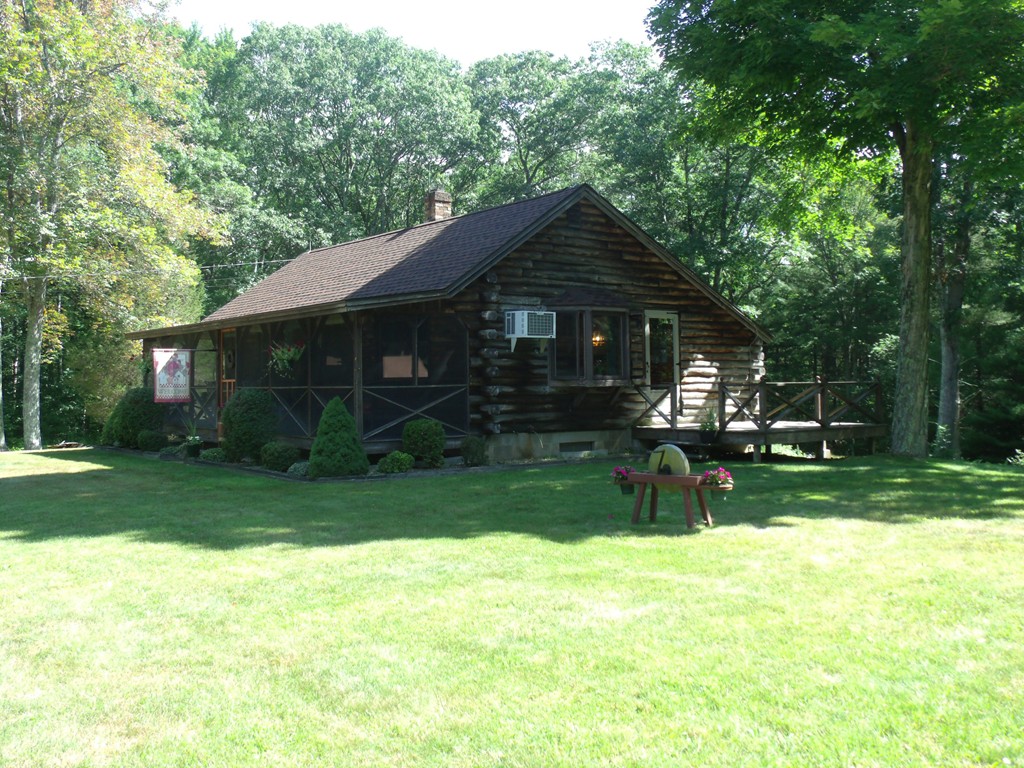 25 Lynch Road Wales, MA 01081 - Photo 1 of 28 a view of a house with a yard porch and sitting area