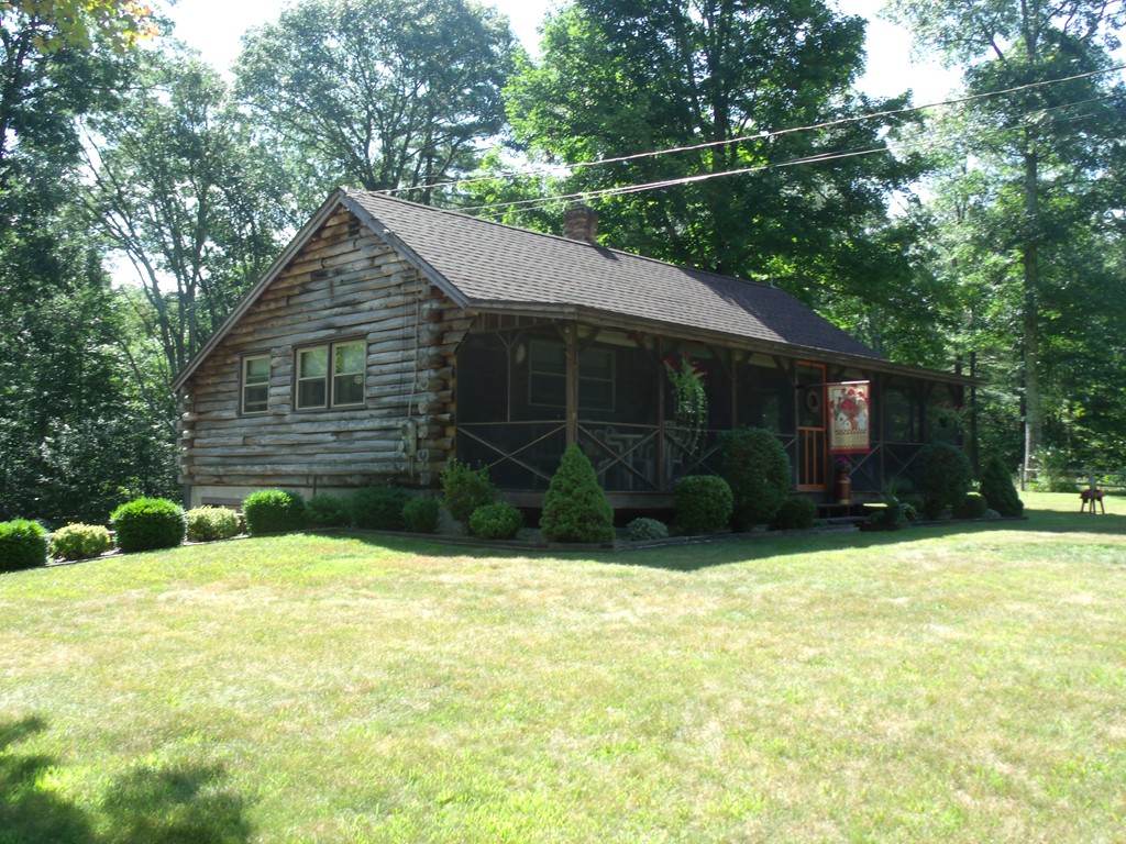 25 Lynch Road Wales, MA 01081 - Photo 2 of 28 a view of a house with a yard