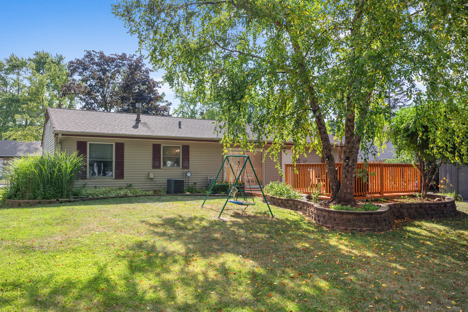 211 David Drive Streamwood, IL 60107 - Photo 19 of 24 a view of a house with backyard and a tree