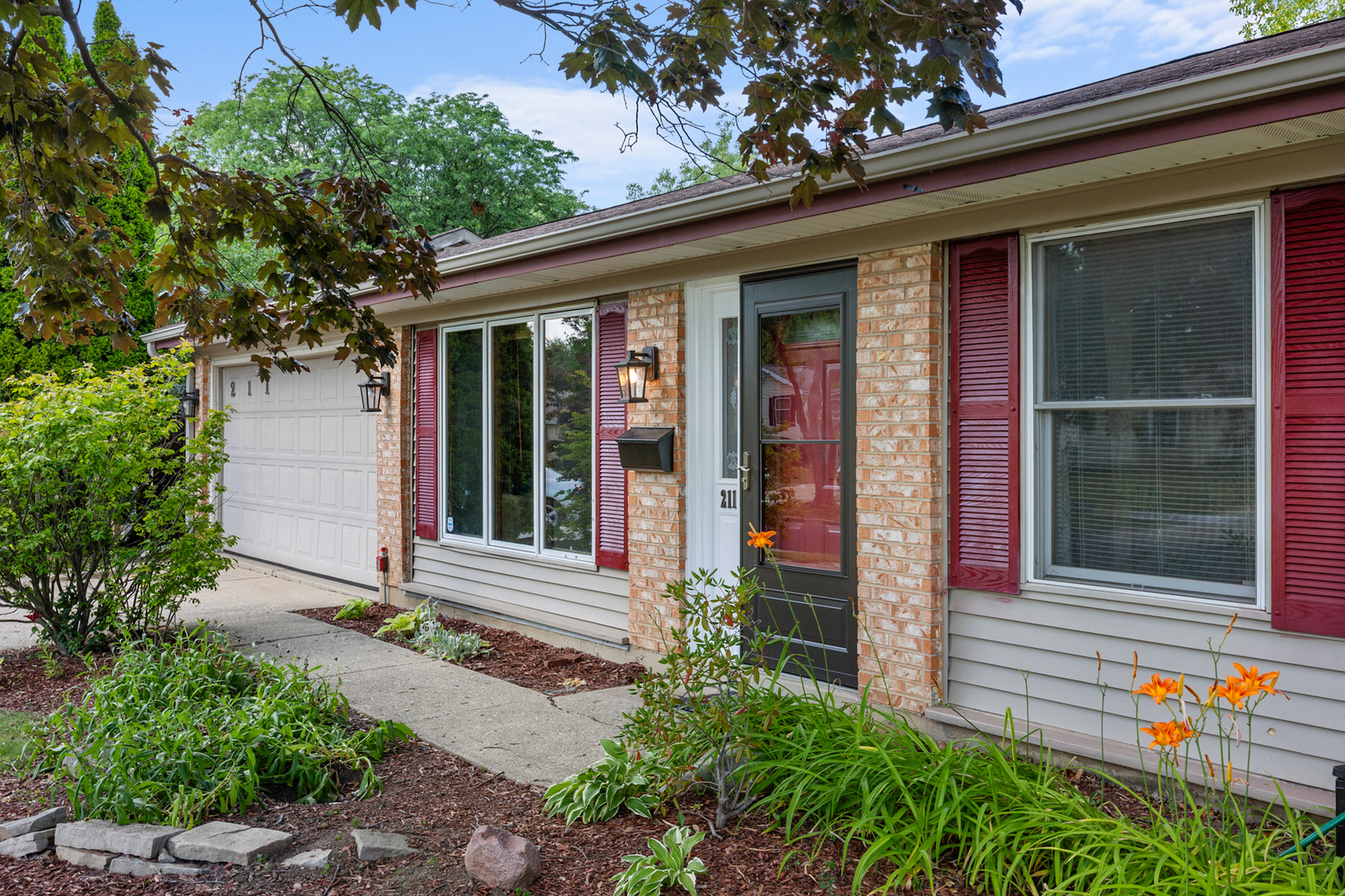 211 David Drive Streamwood, IL 60107 - Photo 2 of 24 front view of a house with a large window