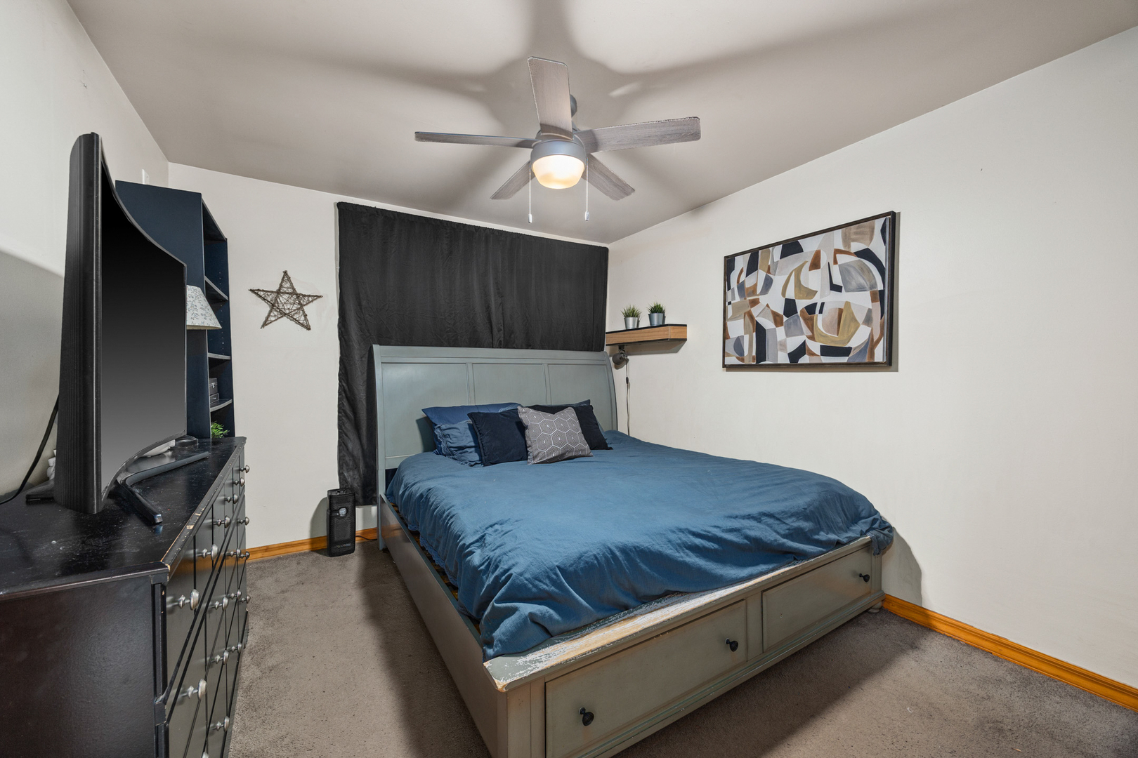 211 David Drive Streamwood, IL 60107 - Photo 10 of 24 a bedroom with a bed and a flat screen tv