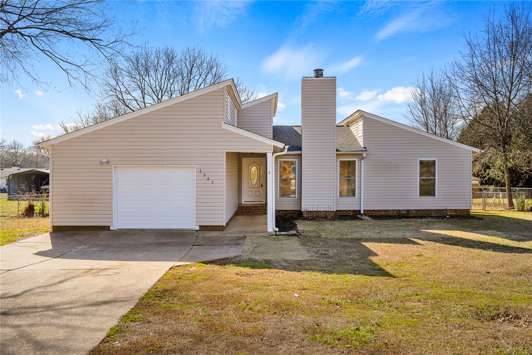 2305 Millgate Road Anderson, SC 29621 - Photo 1 of 18 A well-maintained facade with modern lines and a practical attached garage, complemented by a neatly kept front yard.
