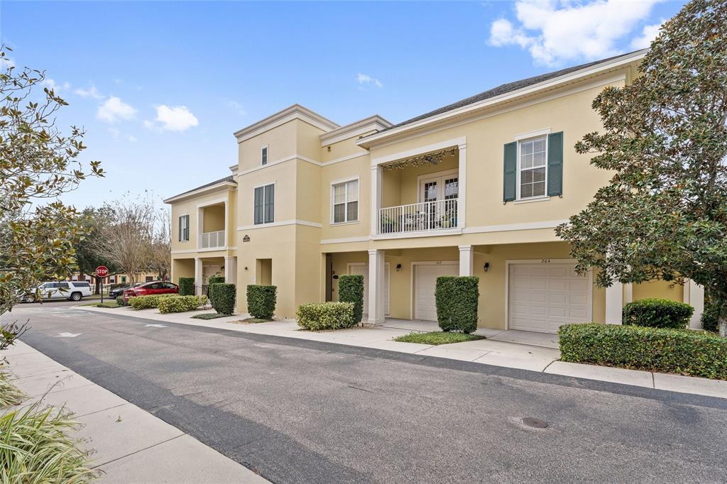 1819 Common Way Road, Unit 203 Orlando, FL 32814 - Photo 1 of 23 a front view of a house with a street