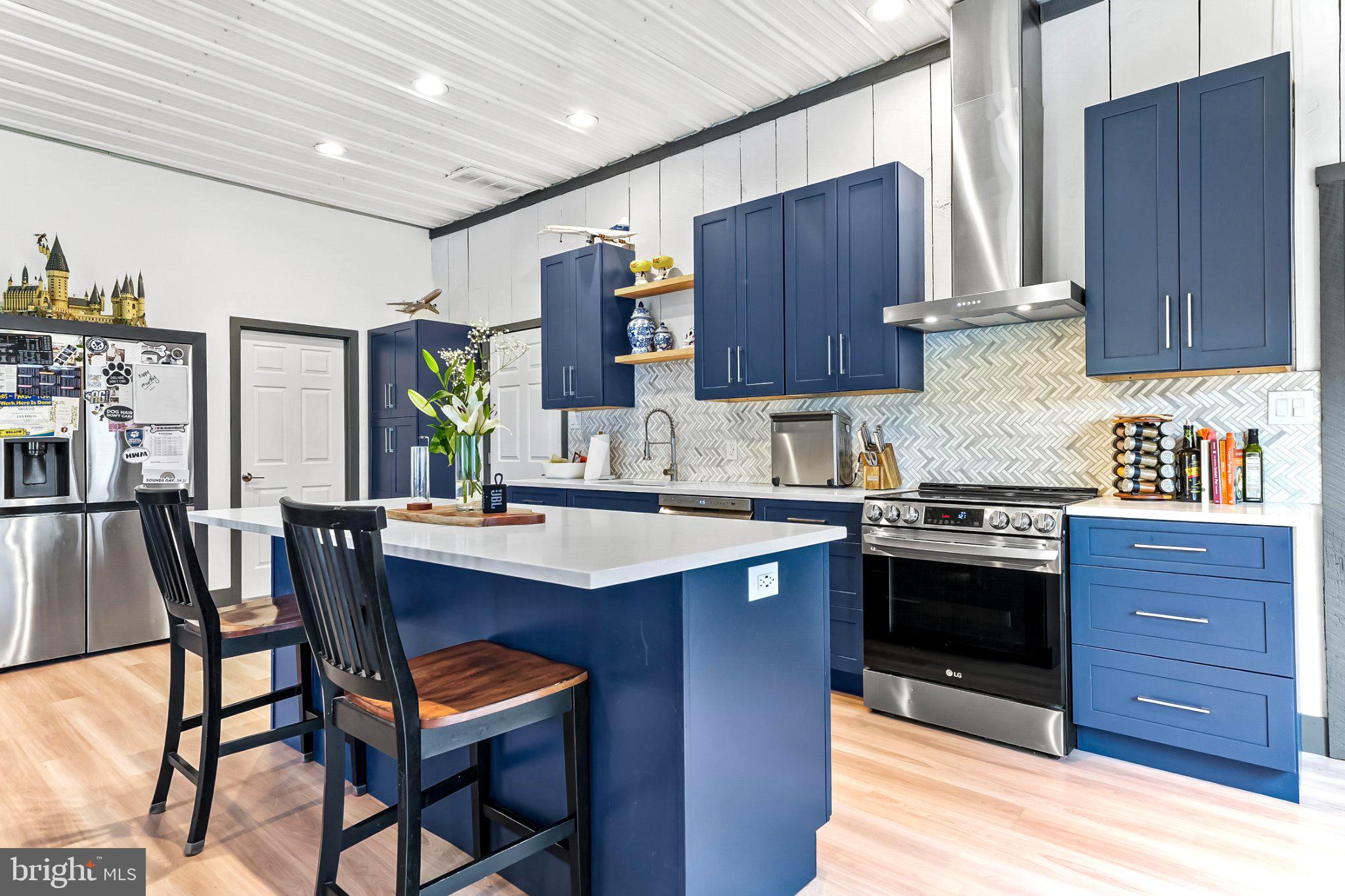 928 Stargazer Road Coatesville, PA 19320 - Photo 11 of 22 Modern kitchen with navy accents.