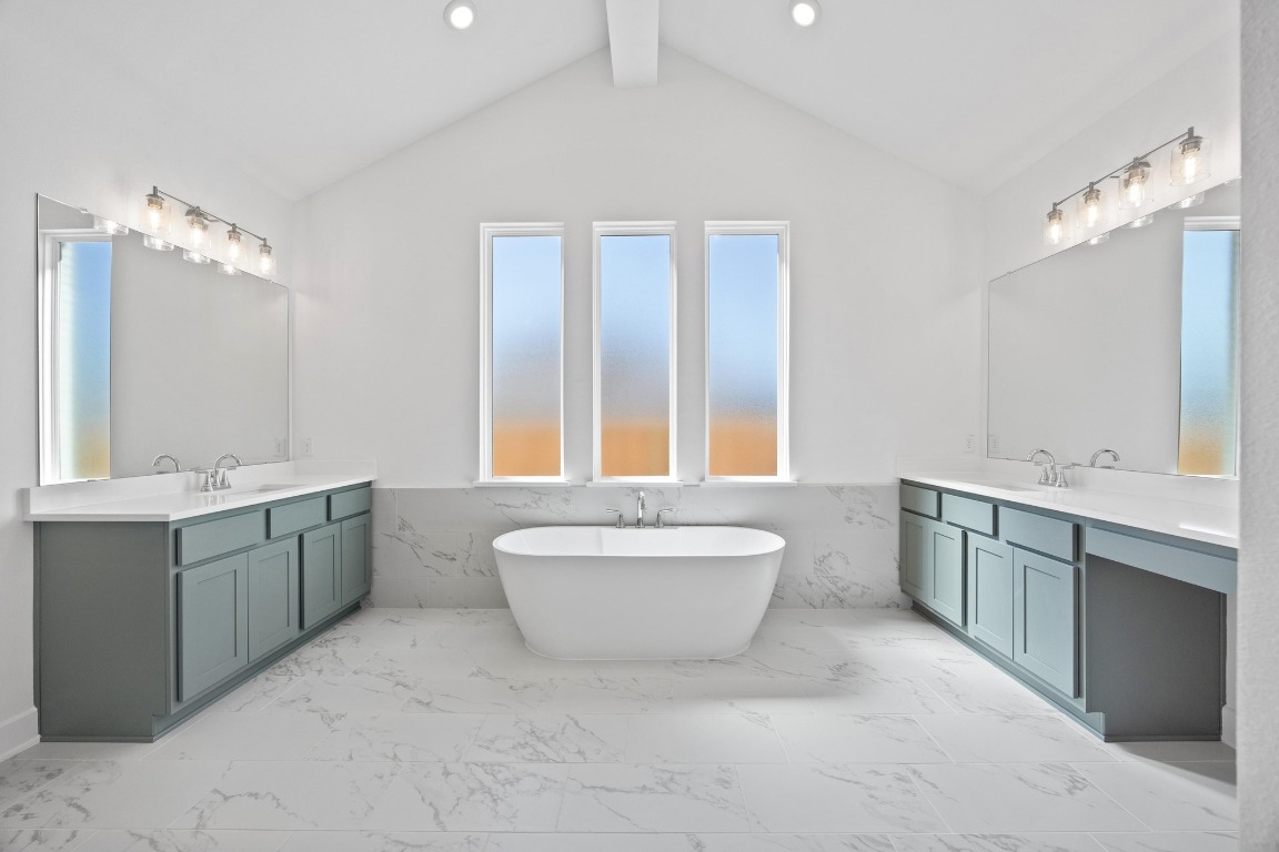 320 Buckaroo Drive Georgetown, TX 78633 - Photo 11 of 31 a spacious bathroom with a double vanity sink mirror and toilet