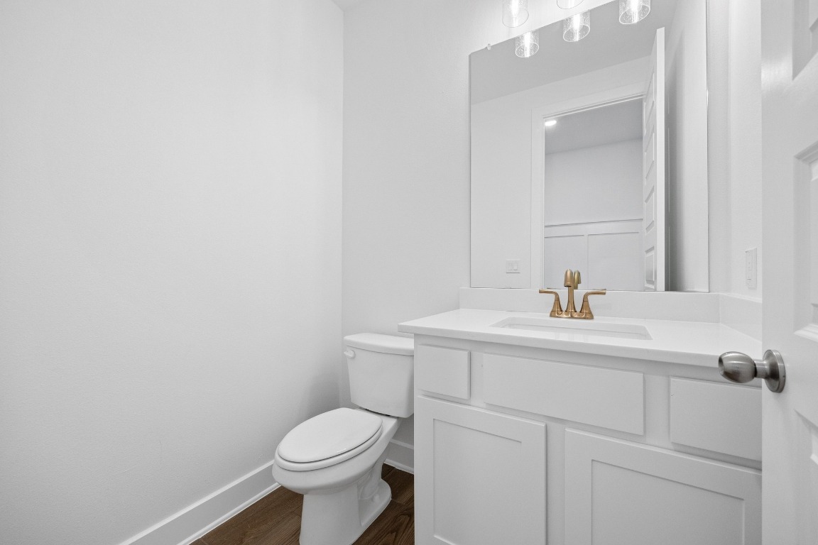 320 Buckaroo Drive Georgetown, TX 78633 - Photo 14 of 31 a bathroom with a sink a toilet and mirror