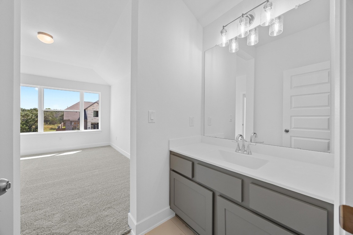 320 Buckaroo Drive Georgetown, TX 78633 - Photo 20 of 31 a bathroom with a sink and a mirror