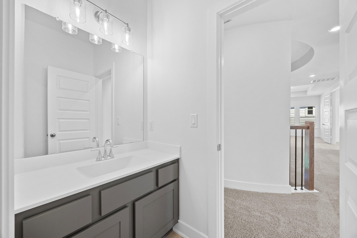 320 Buckaroo Drive Georgetown, TX 78633 - Photo 21 of 31 a bathroom with a sink vanity and a mirror