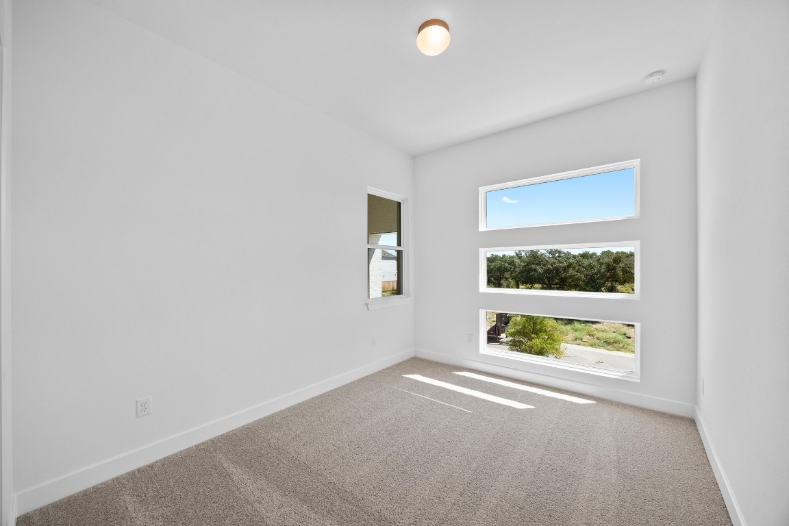320 Buckaroo Drive Georgetown, TX 78633 - Photo 22 of 31 an empty room with windows