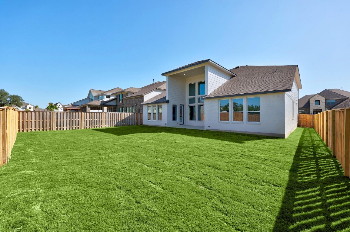 320 Buckaroo Drive Georgetown, TX 78633 - Photo 26 of 31 a house view with a garden space