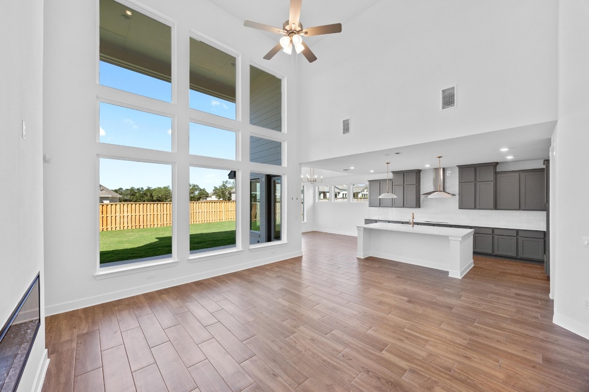 320 Buckaroo Drive Georgetown, TX 78633 - Photo 4 of 31 a view of kitchen with windows and refrigerator