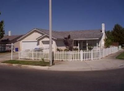 15109 Daisy Road Adelanto, CA 92301 - Photo 1 of 1 a view of a house with a fence