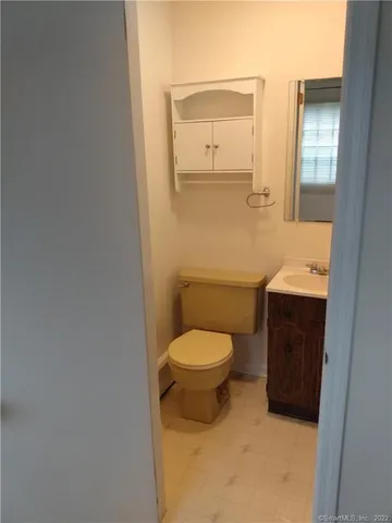 a bathroom with a toilet and a sink