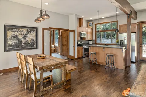 a view of a dining room with furniture window and wooden floor