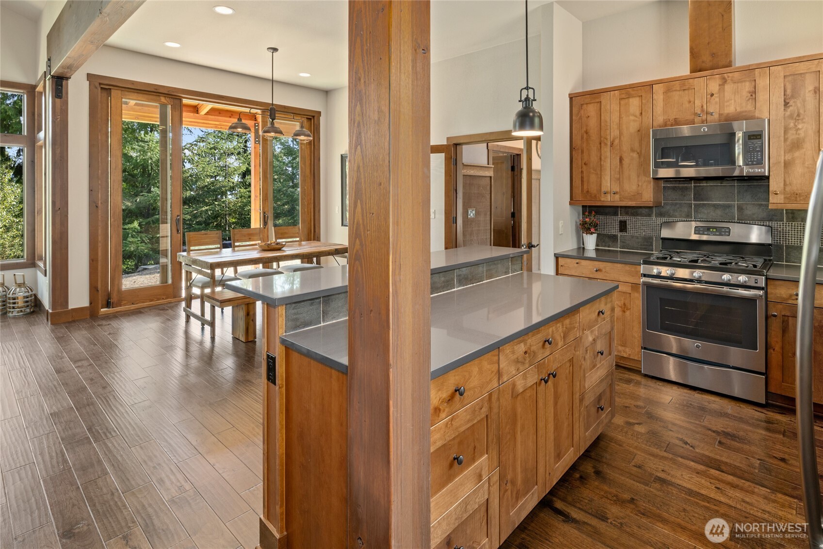 632 Trailside Drive Cle Elum, WA 98922 - Photo 12 of 39 a kitchen with stainless steel appliances granite countertop a stove top oven a sink and a refrigerator