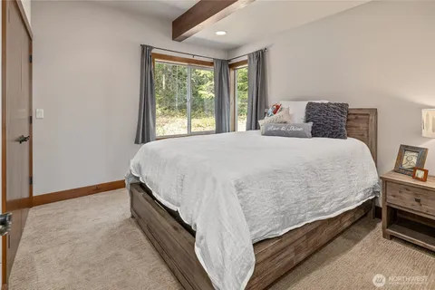 a bedroom with a bed and dresser